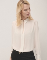 Beige blouse with front opening and pleat