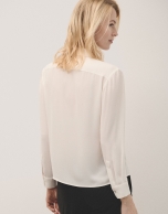 Beige blouse with front opening and pleat