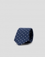 Navy blue silk tie with white tennis ball print jacquard