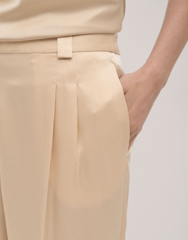 Beige crepe satin tailored pants with rolled-up hem