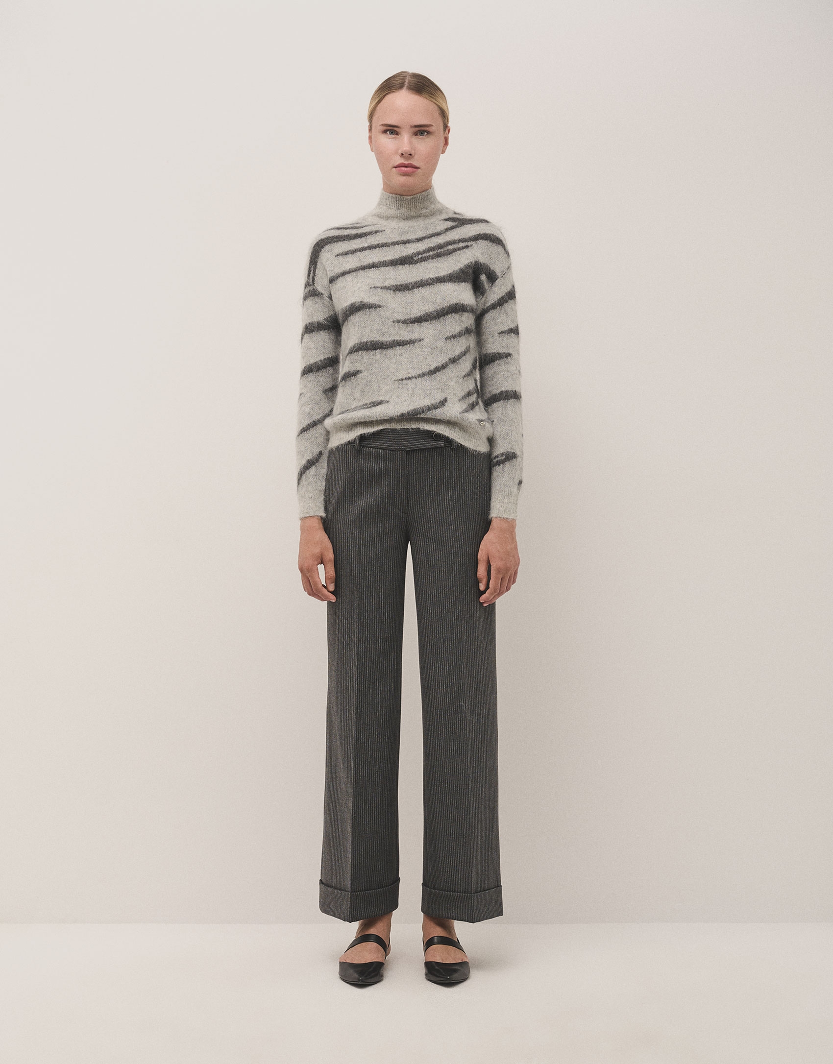 Grey tailored herringbone and discontinuous pinstriped pants with rolled-up hem