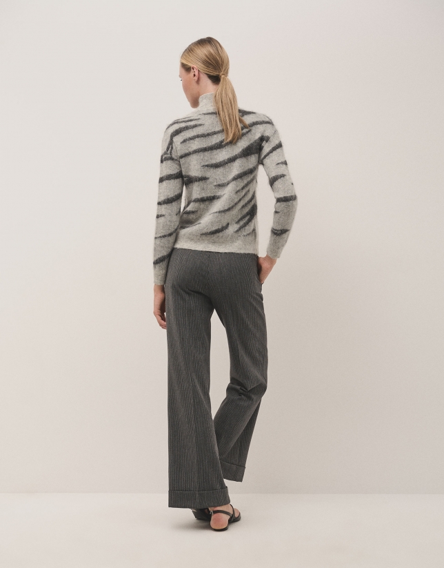 Grey tailored herringbone and discontinuous pinstriped pants with rolled-up hem