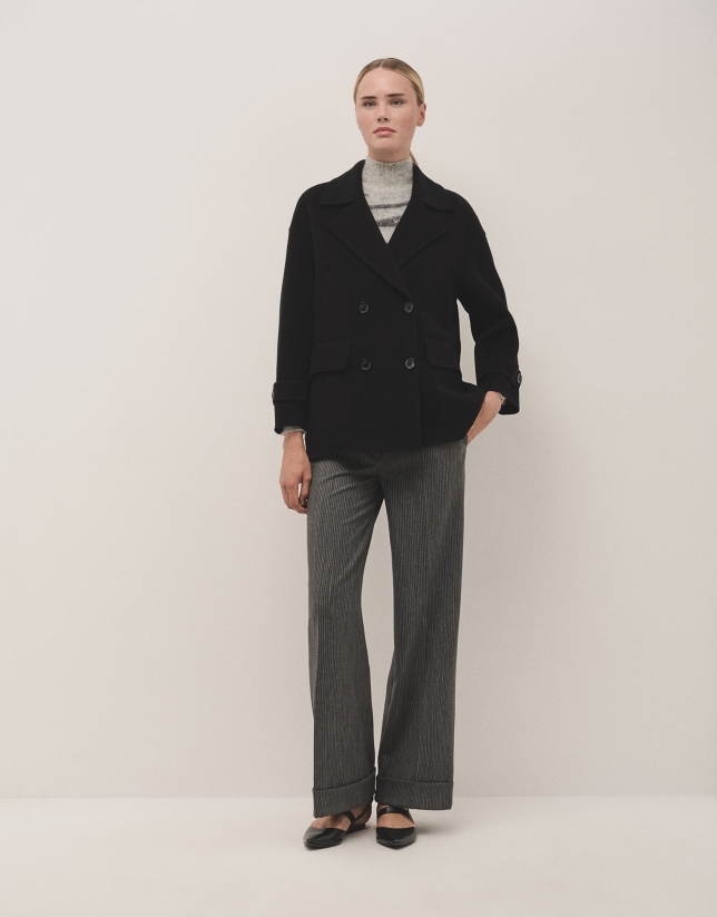 Grey tailored herringbone and discontinuous pinstriped pants with rolled-up hem