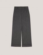 Grey tailored herringbone and discontinuous pinstriped pants with rolled-up hem