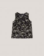 Top de sisas negro estampado flores beige