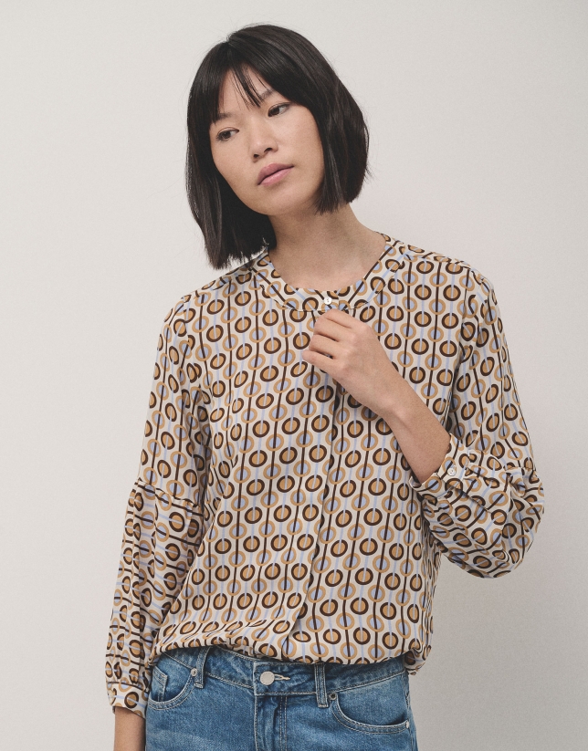 Beige and blue geometric print blouse with puffed sleeves