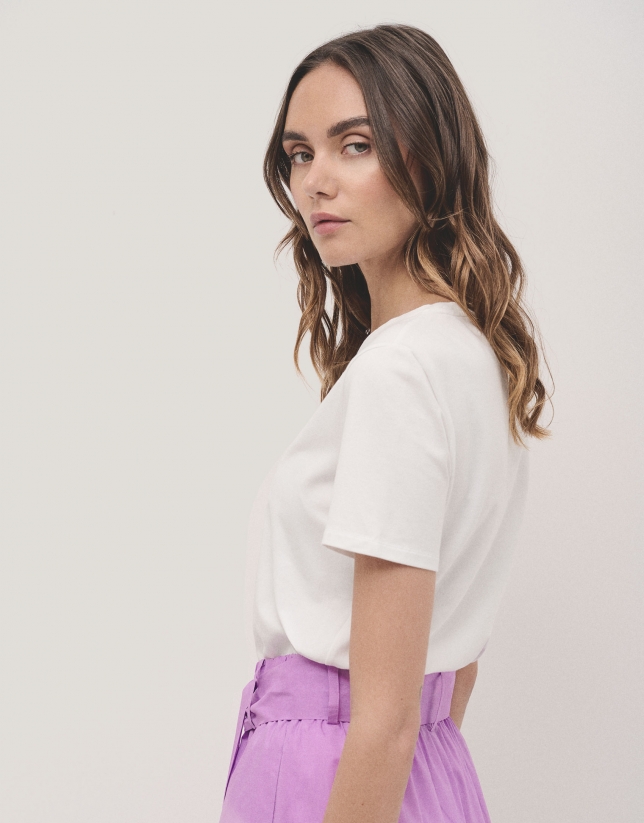 White cotton top with openwork embroidered flower