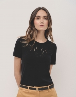 Black cotton top with openwork embroidered flower