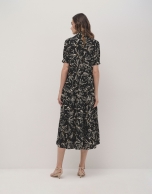 Black shirtwaist midi dress with beige floral print