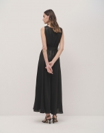 Sleeveless long dress in black lame