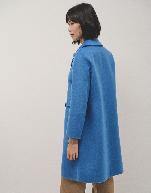 Long straight double-breasted coat in double-faced blue cloth