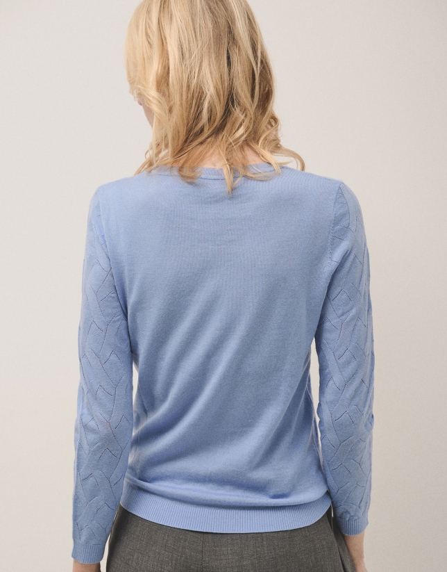 Blue boat neck jumper with crossover knitting