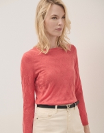 Orange boat neck jumper with crossover knitting