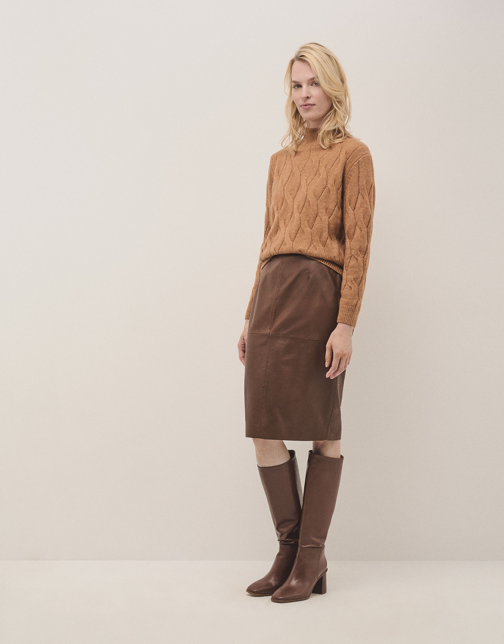 Oversize jumper in a camel chunky cable stitch knitting