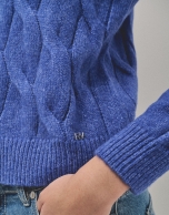 Oversize jumper in a blue chunky cable stitch knitting