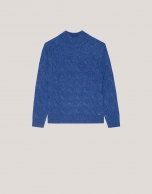 Oversize jumper in a blue chunky cable stitch knitting