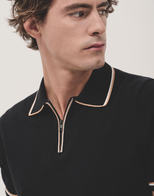 Black knitted polo shirt with white outline