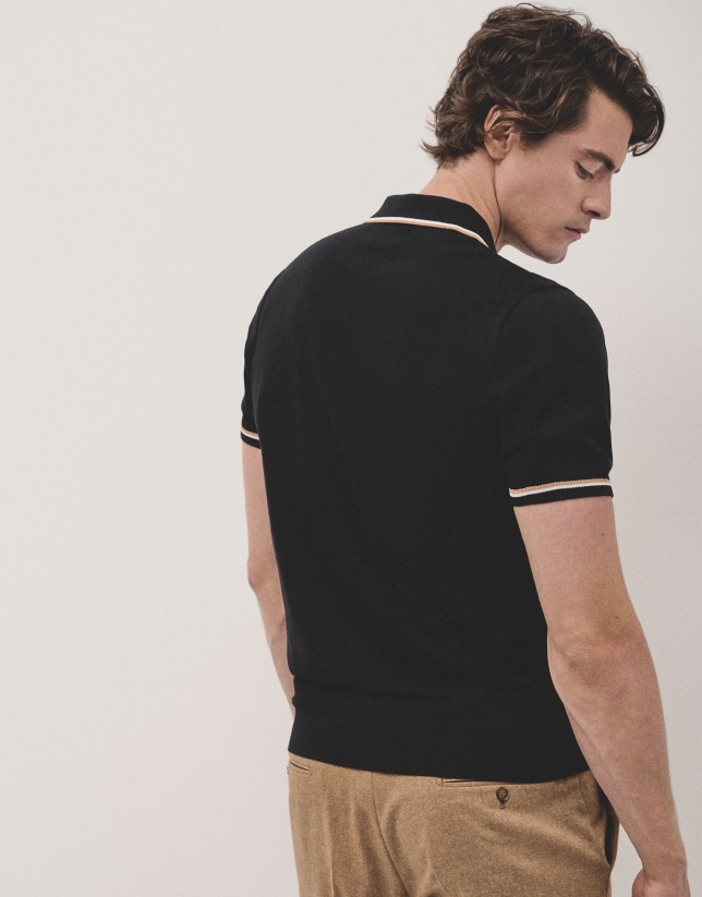 Black knitted polo shirt with white outline