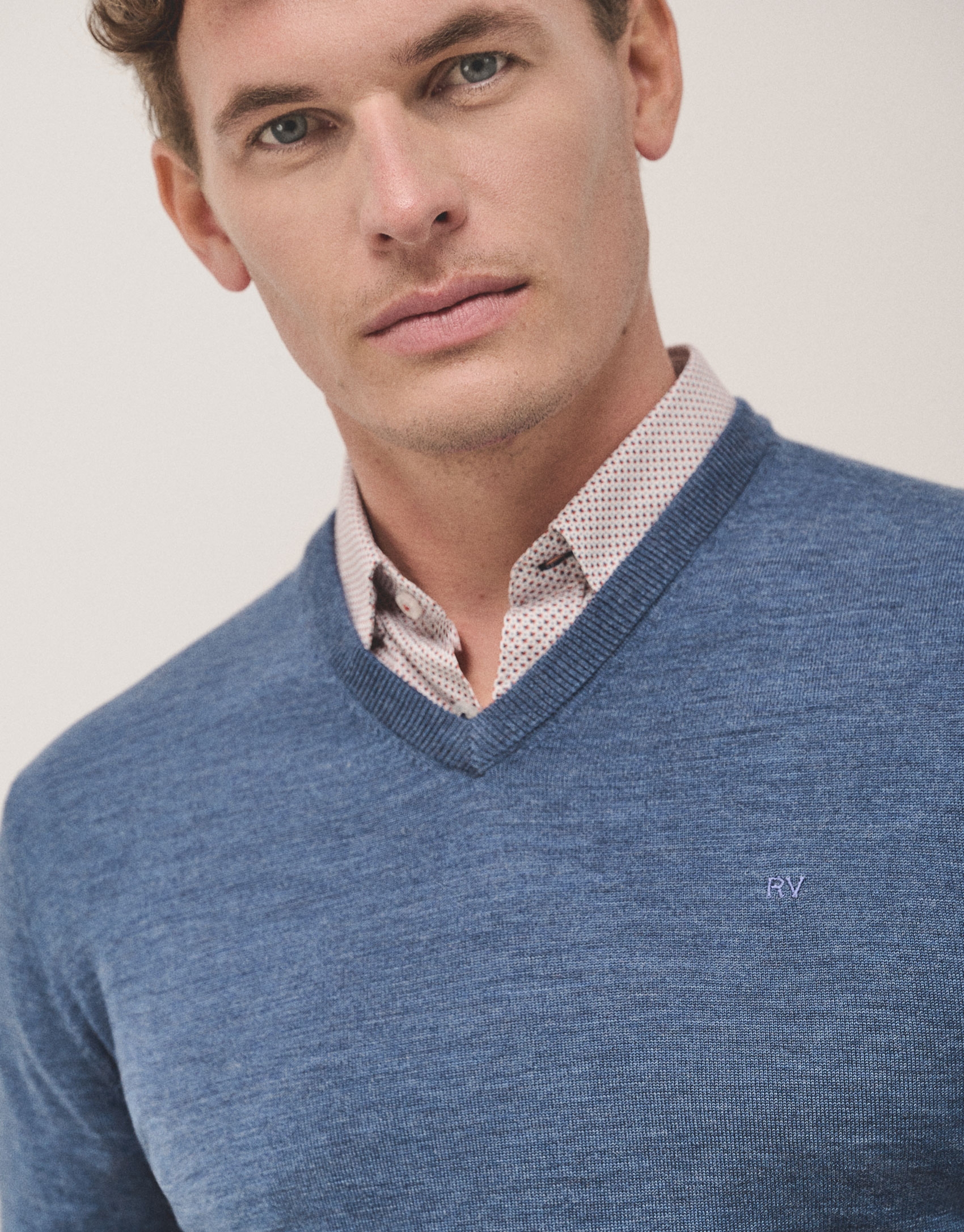 Medium blue wool sweater with V-neck 