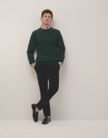 Dark green cable-stitched sweater