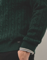 Dark green cable-stitched sweater