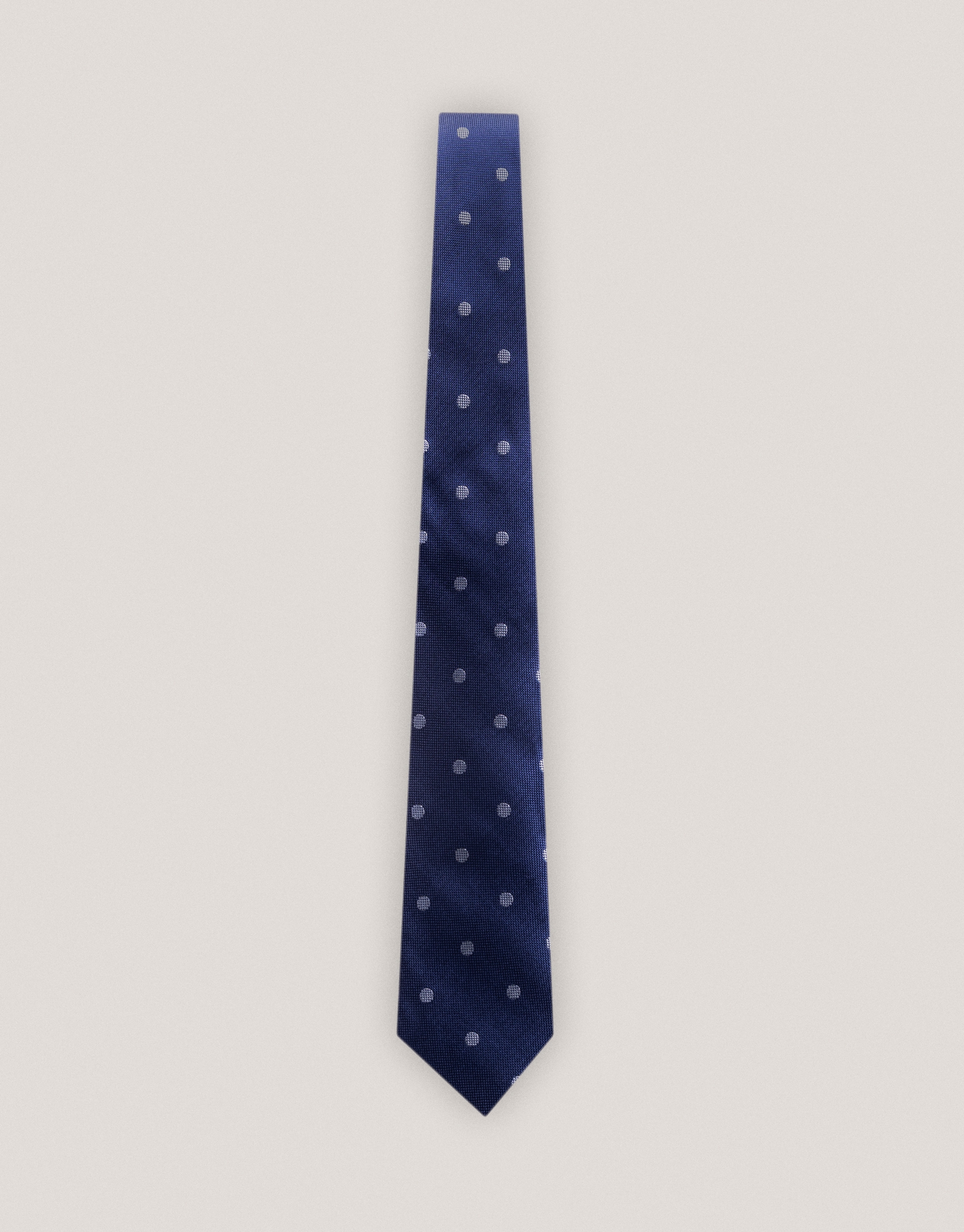 Blue silk tie with white polka dots