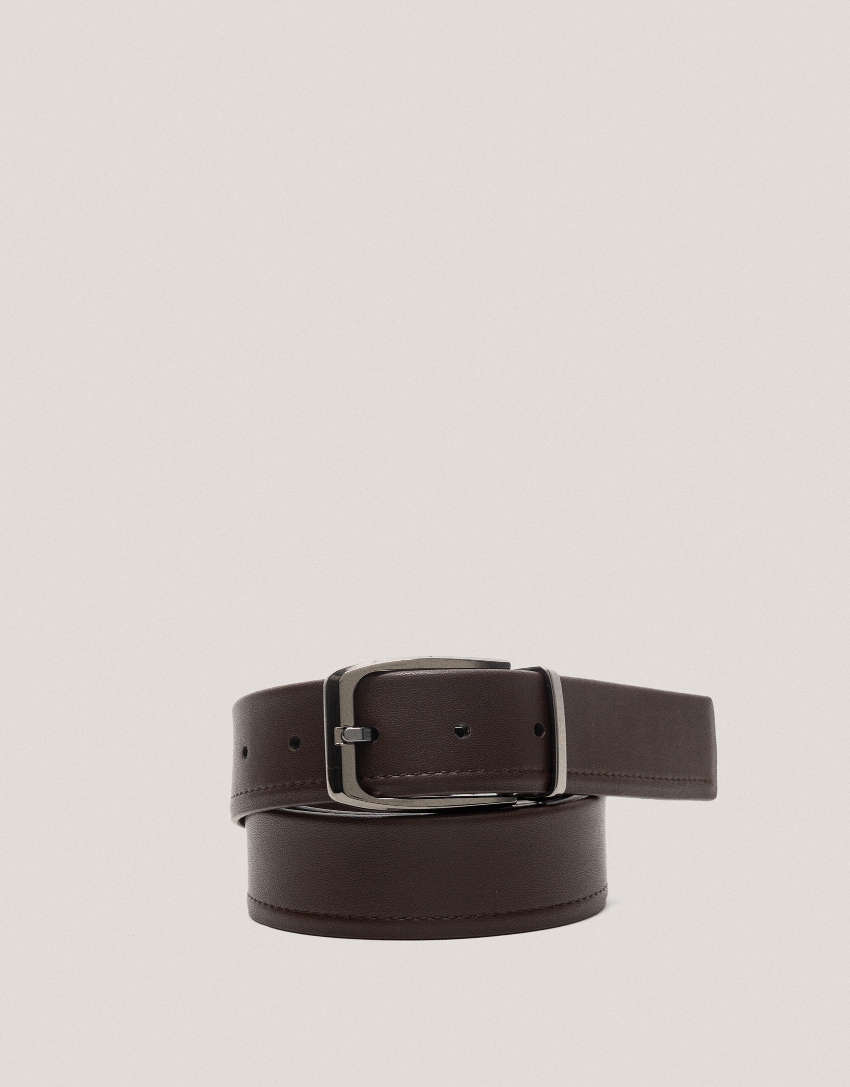 Brown leather belt with decorative cuts