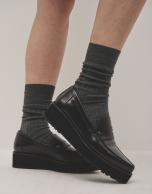 Black leather platform moccasins