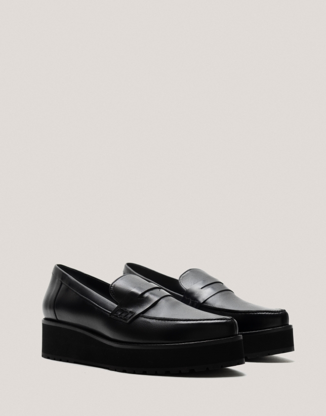 Black leather platform moccasins