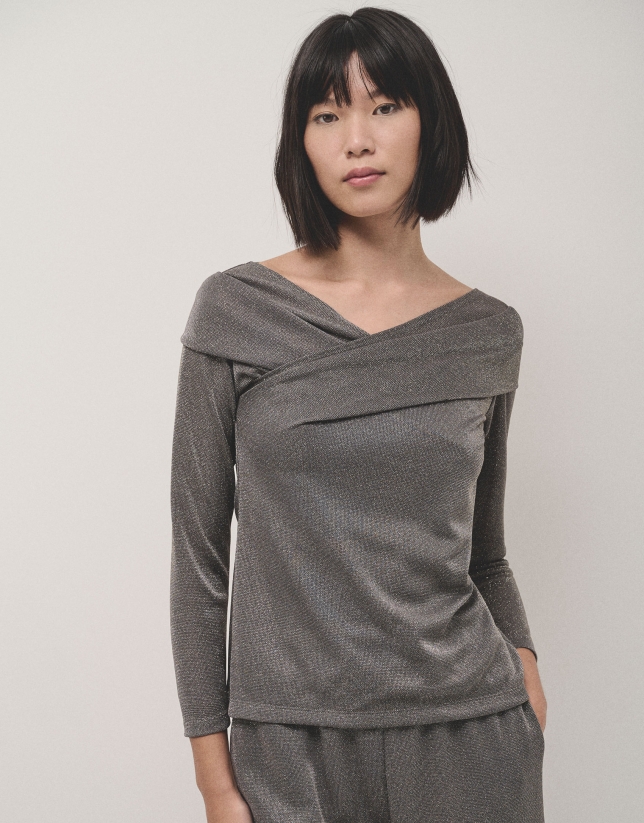 Shiny gray knit top with crossover neckline