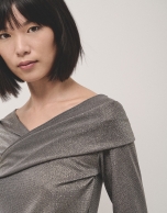 Shiny gray knit top with crossover neckline