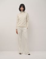 Ivory knit sweater with cable-stitching