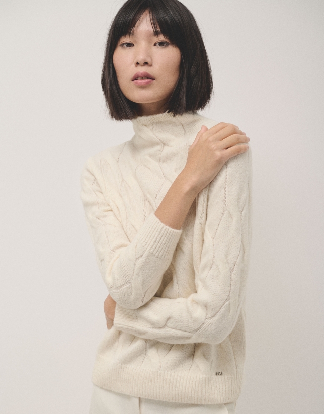 Ivory knit sweater with cable-stitching