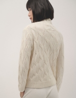 Ivory knit sweater with cable-stitching